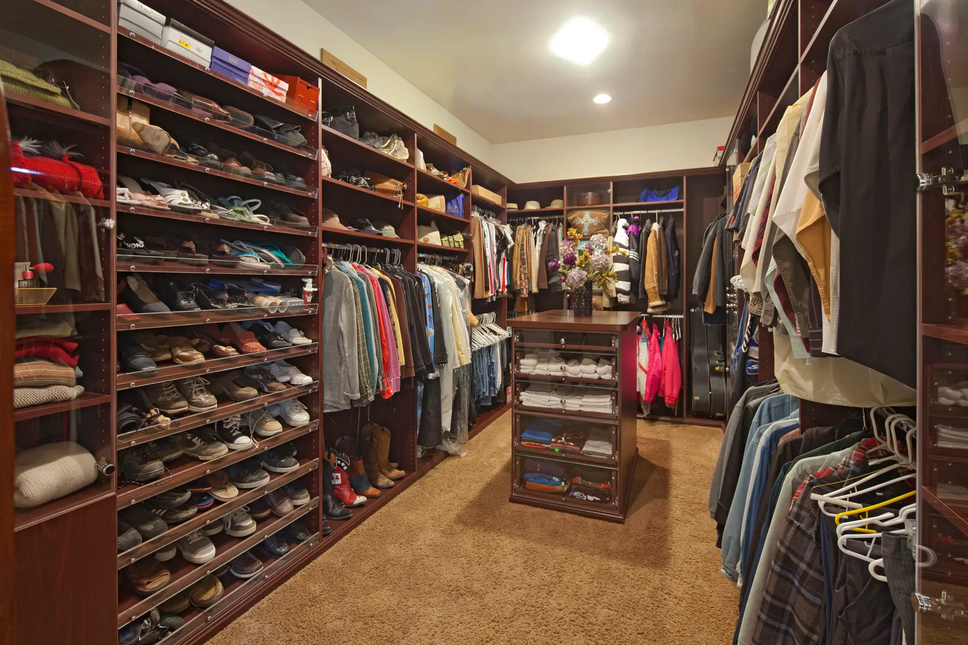 Closet islands in a walk-in closet in Rochester, NY